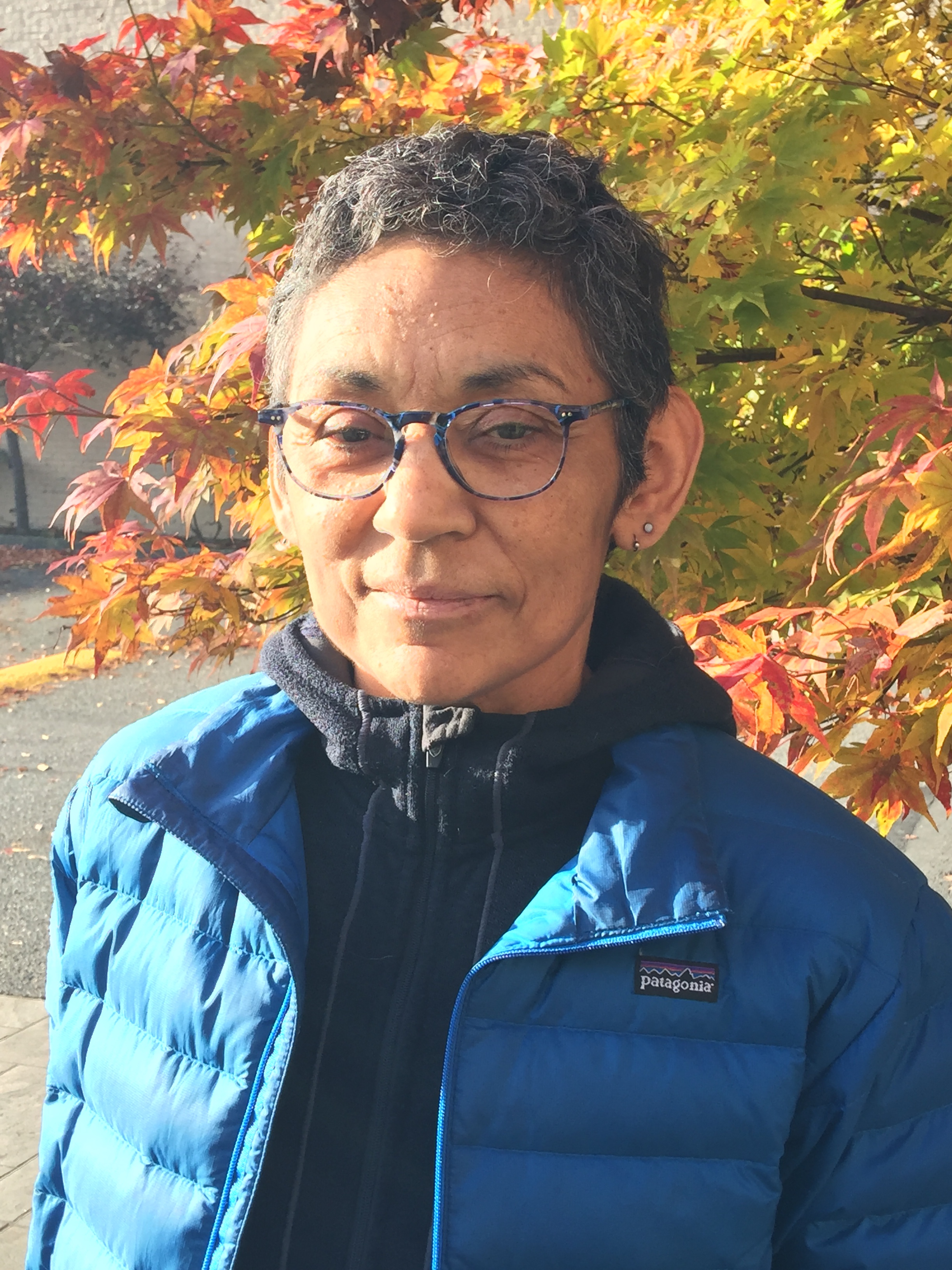 Professor Debra Salazar stands in front of a tree